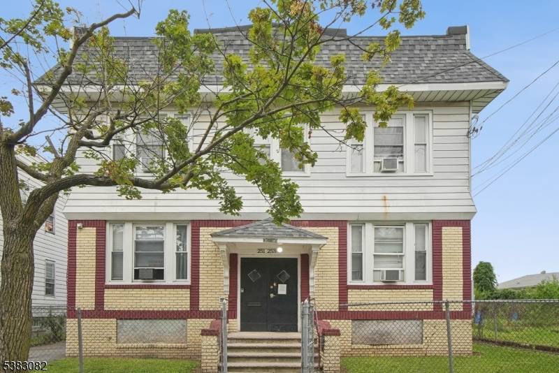 Welcome to this impressive quadplex situated in the vibrant neighborhood of Irvington, New Jersey.