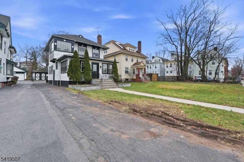 First, you have to appreciate the massive size of this lot, which extends well beyond the garage, offering incredible potential on a 36 x 230 property.