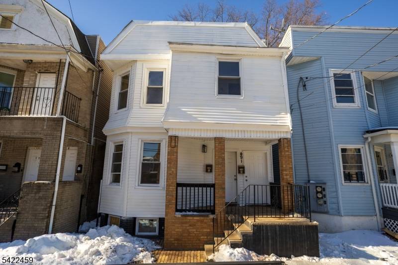 Newly updated 2 family home with INCREDIBLE LOW TAXES for owner occupant or investor !