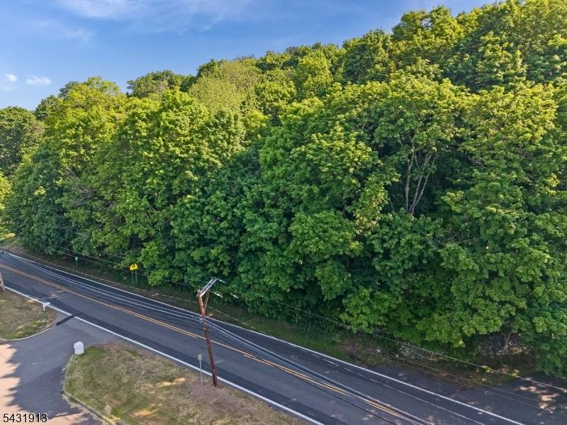 Four unimproved parcels of land for sale with road frontage, includes Block 4 ; Lots 3, 4, 5 and 6.