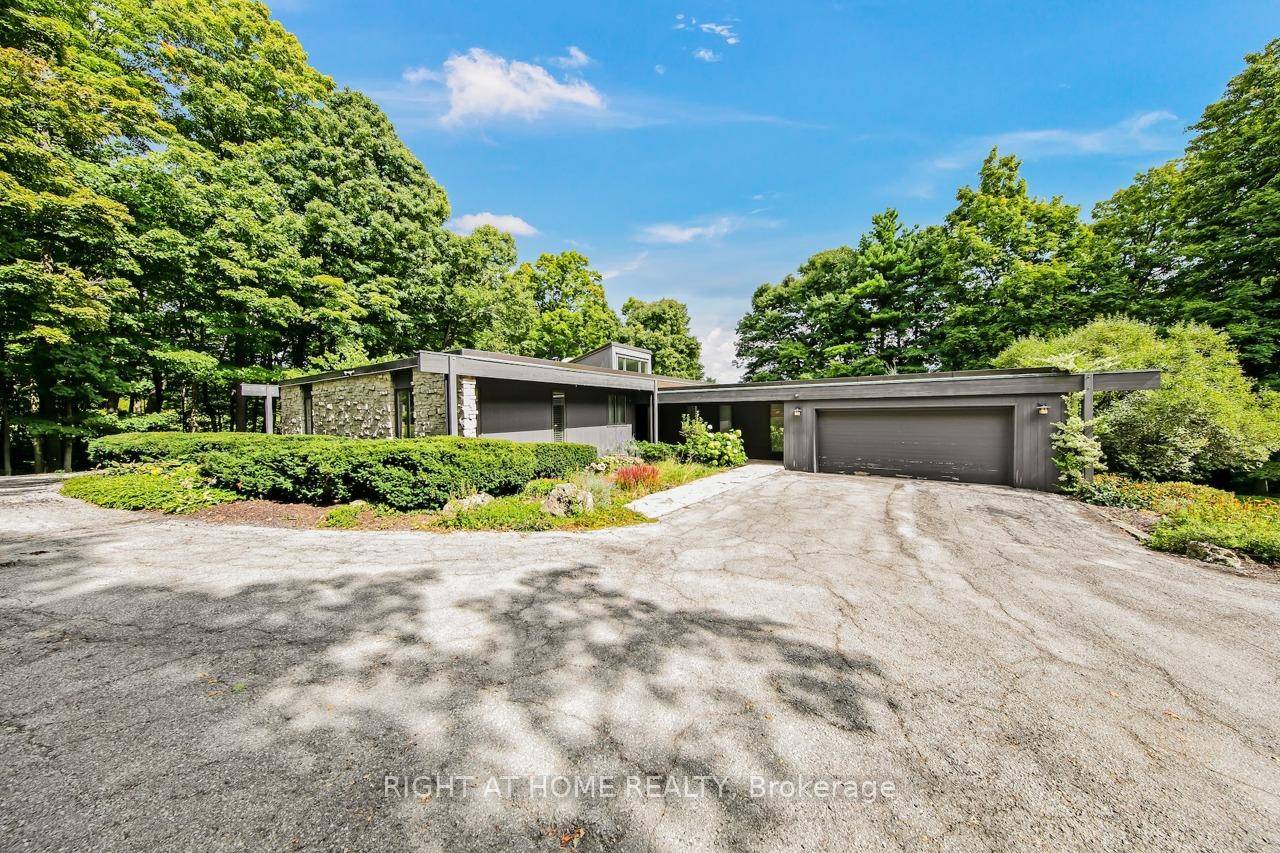 Stunning Frank Lloyd Wright Inspired Estate with Sweeping Escarpment Views !
