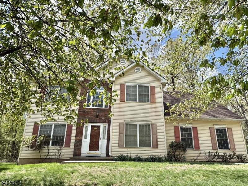 Spacious Colonial situated on a private half acre cul de sac lot, featuring hardwood floors and generously sized rooms throughout.