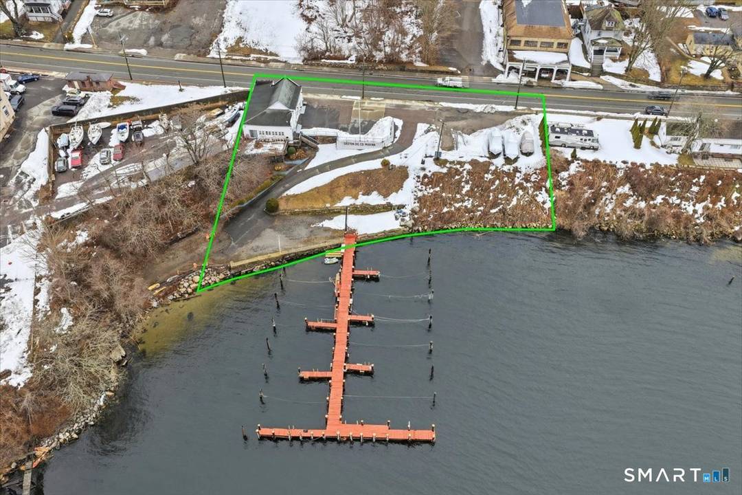 A rare opportunity to acquire direct Thames River frontage in the heart of Groton's historic commercial corridor.