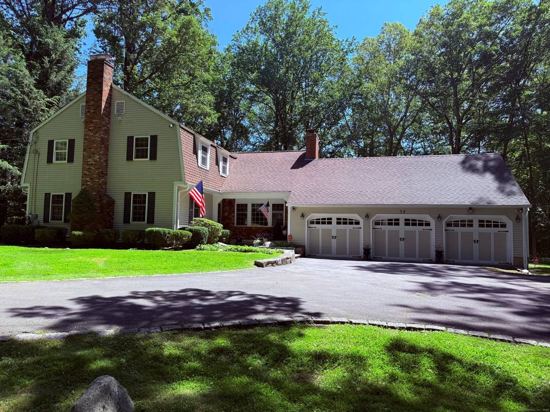 Move right into this beautiful, classic colonial home, nestled on over an acre of land on a quiet North Stamford cul de sac.