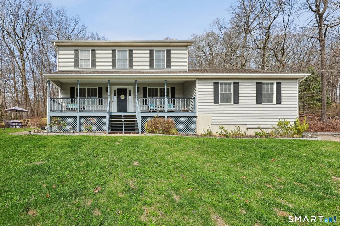 Welcome to this beautifully maintained Colonial nestled on a private, lightly wooded 2.