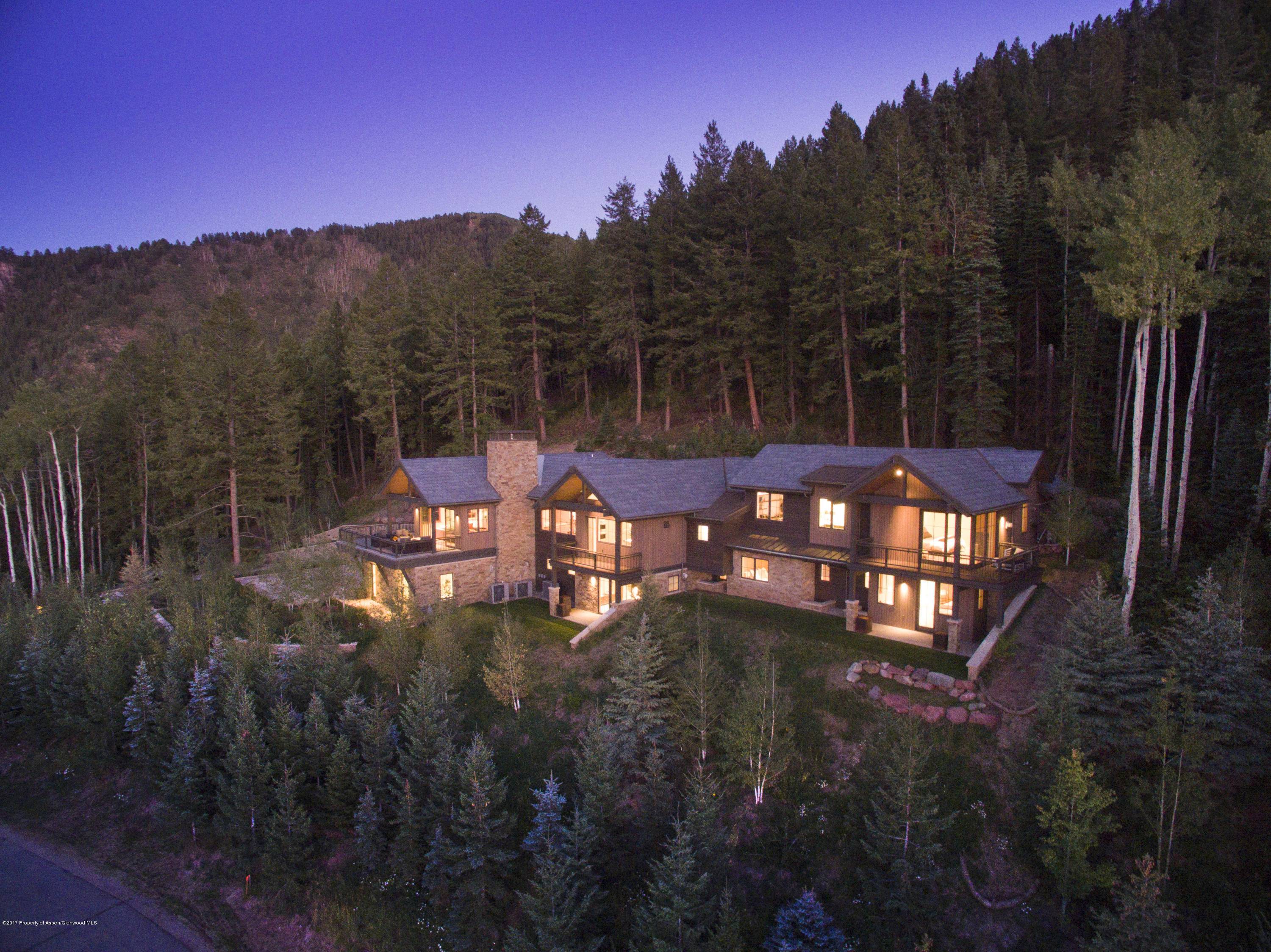 Spectacular contemporary estate situated on the highest Lot in Five Trees Subdivision.