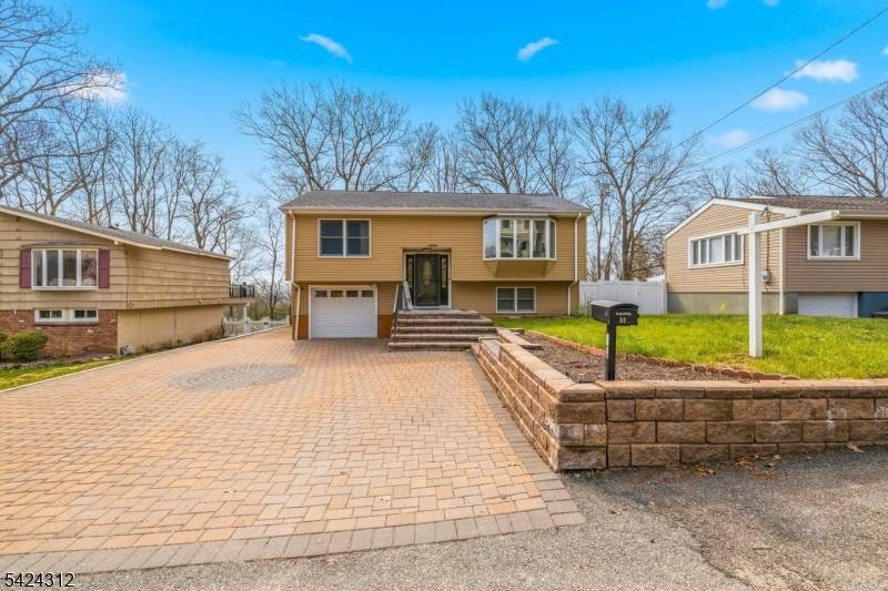 This spacious updated bi level home offers 6 bedrooms, 2 full bathrooms, and 2 half baths, providing plenty of room for comfortable living and entertaining.