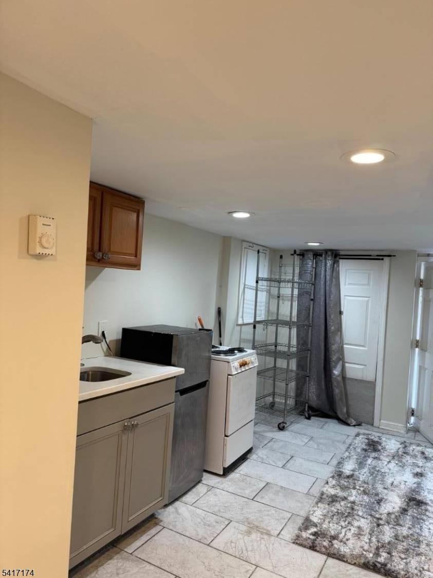 Spacious 4 bedrooms, 3 bath home, Low property taxes, close to Newark City Rail.