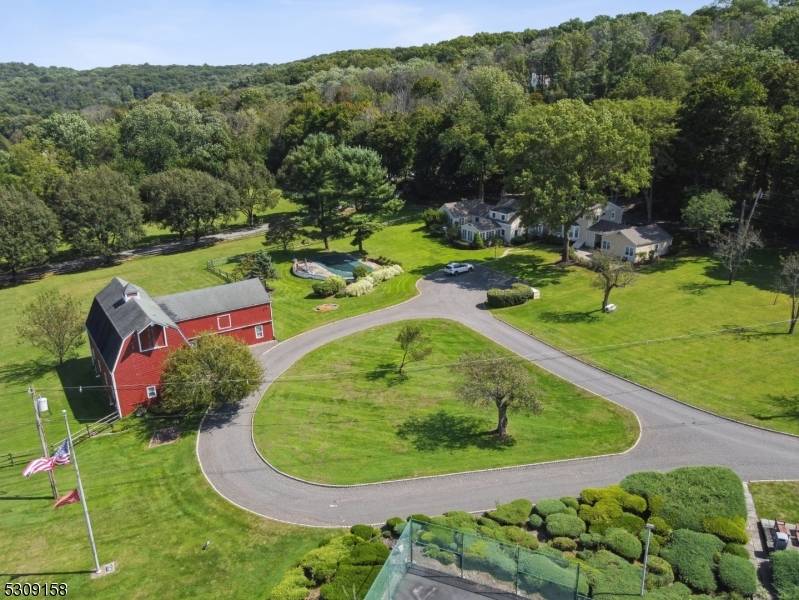 Welcome to Three Orchards, a gated level five acres in the Roxiticus Valley section of Mendham Township.