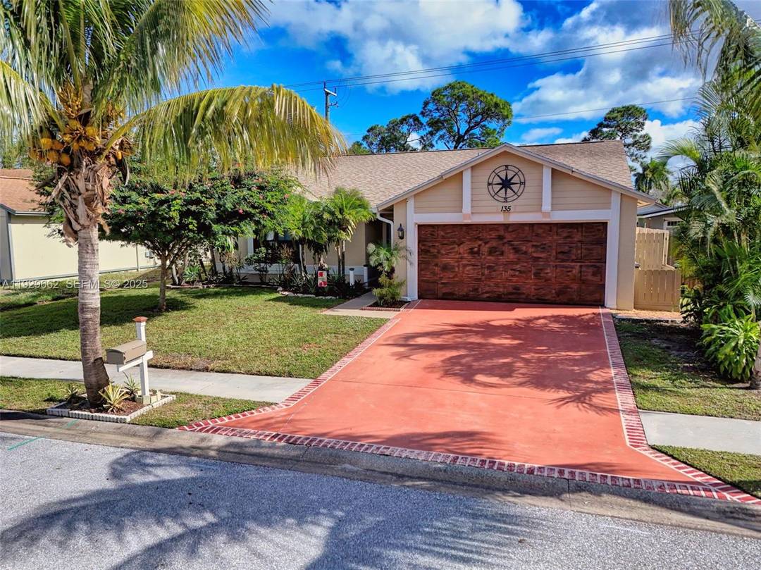 YOUR WAIT IS OVER.... FULLY RENOVATED 3 Bedroom Great Room, 2 Bath, 2 Car Garage, Canal Front Home in Sought After ROSEWOOD CIRCLE at JUPITER VILLAGE.