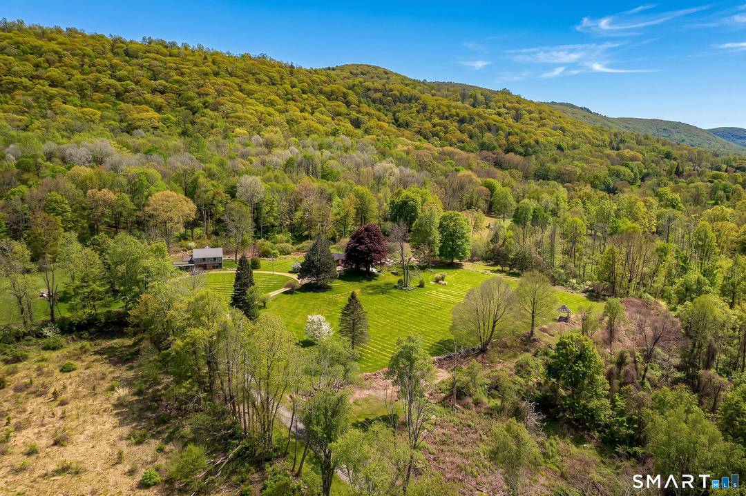 Set well back from the road on more than 29 private acres, this single level three bedroom home offers something increasingly rare in Litchfield Hills commanding western views, serious acreage, ...