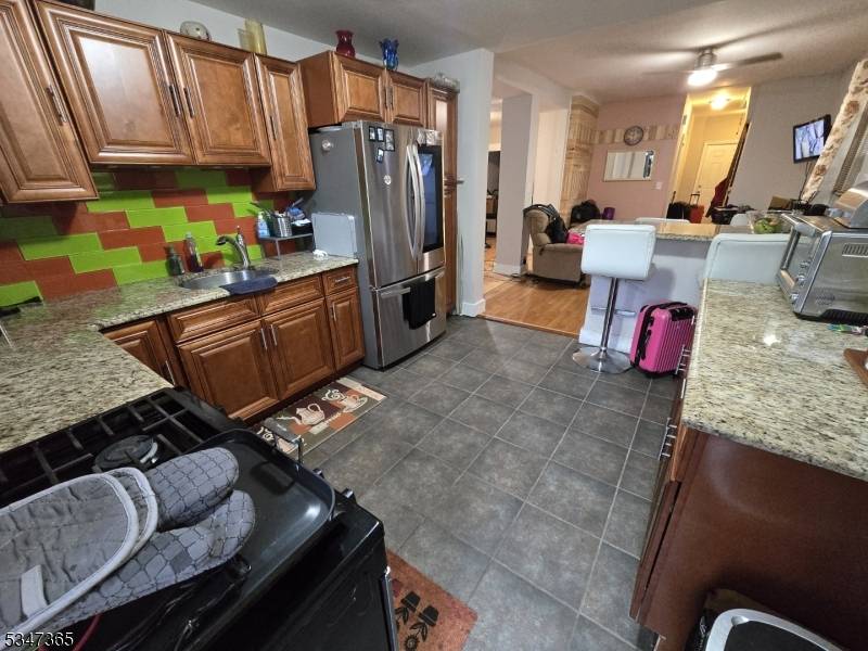 Surrounded by newly built homes this centrally located and recently renovated 3 bedroom, 2 full baths home with central air though out the house is not one to miss !