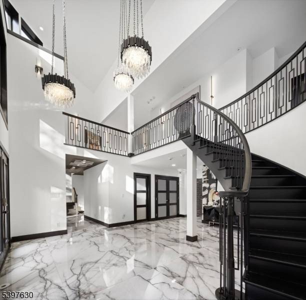 Welcome to this striking, fully renovated modern masterpiece set on over 3 private acres in the prestigious, gated Smoke Rise community.