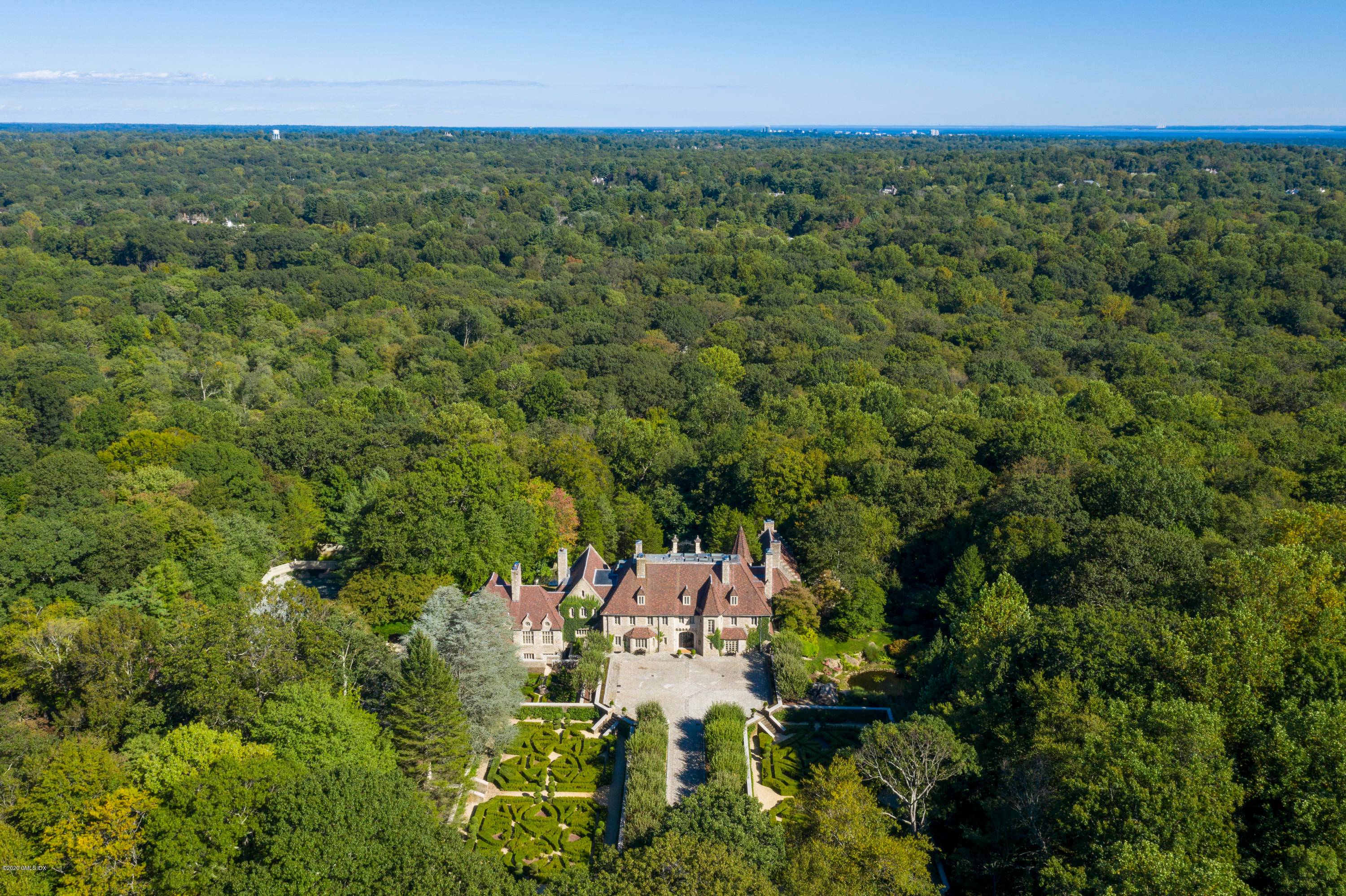 Through a private gate and up an apple tree lined drive, travel back to the 17th century.