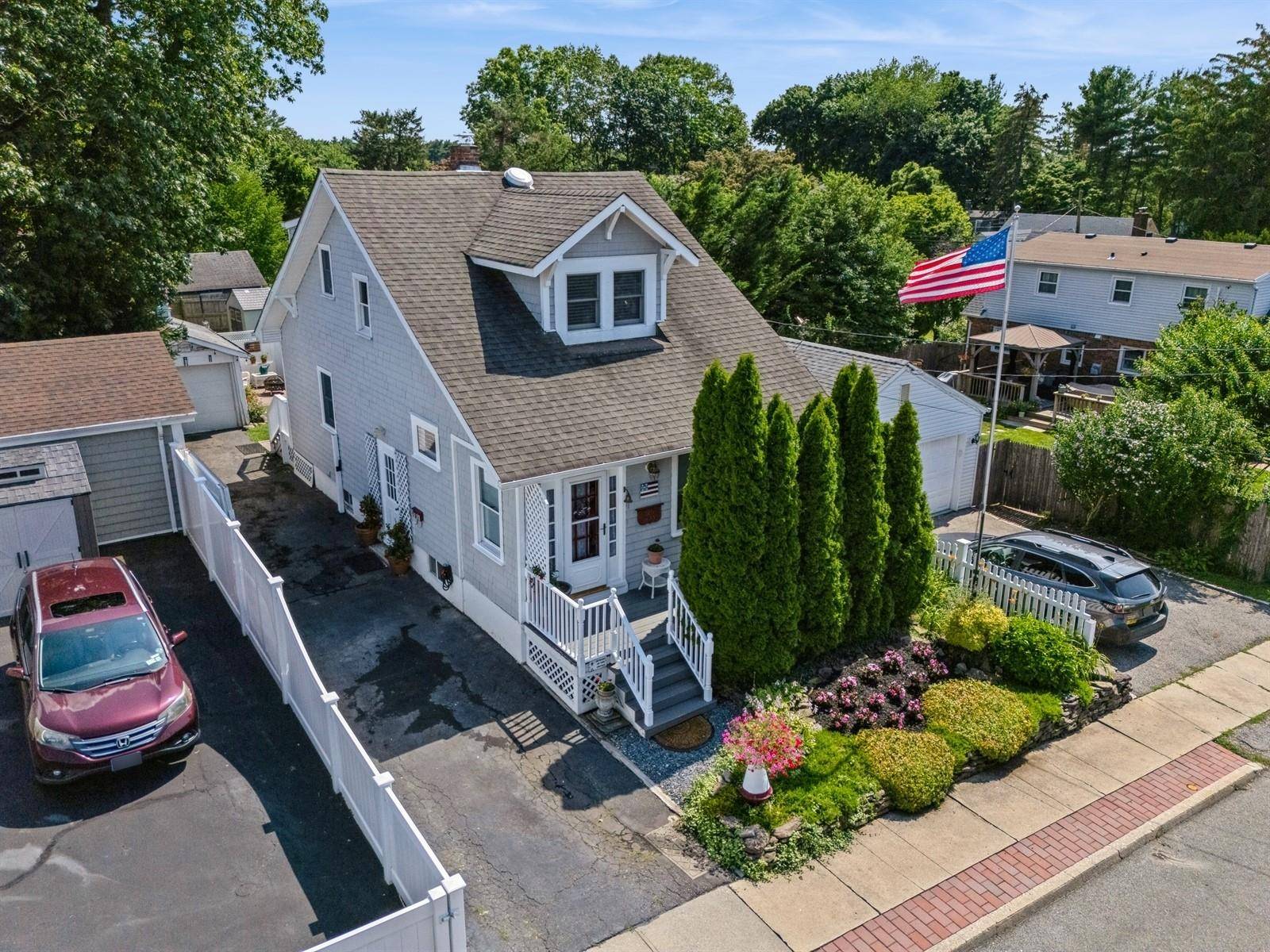 Fall in love with this beautifully updated bungalow style gem in the heart of Locust Valley Village !