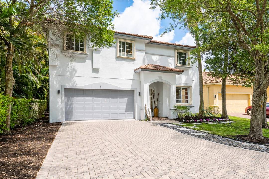 A beautiful 5 BD 3 BA two story home in Boca Vistas with chic wood flooring and a clean, modern feel throughout.