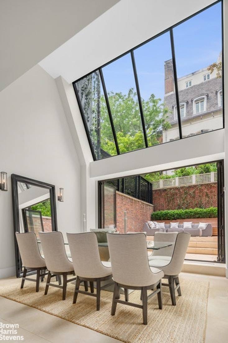 This mint 5 bedroom single family townhouse is located in a prime location on one of the most beautiful blocks on the Upper East Side, off of Park Avenue.
