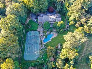 Don't miss this breathtaking home on over 3 acres with a long, sweeping driveway.