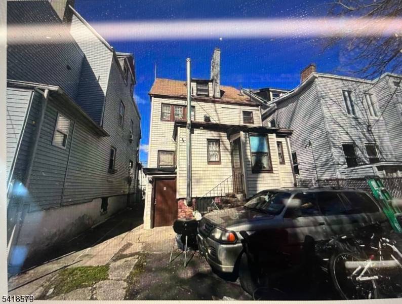 Opportunity knocks with this two family home ready for your vision and updates.