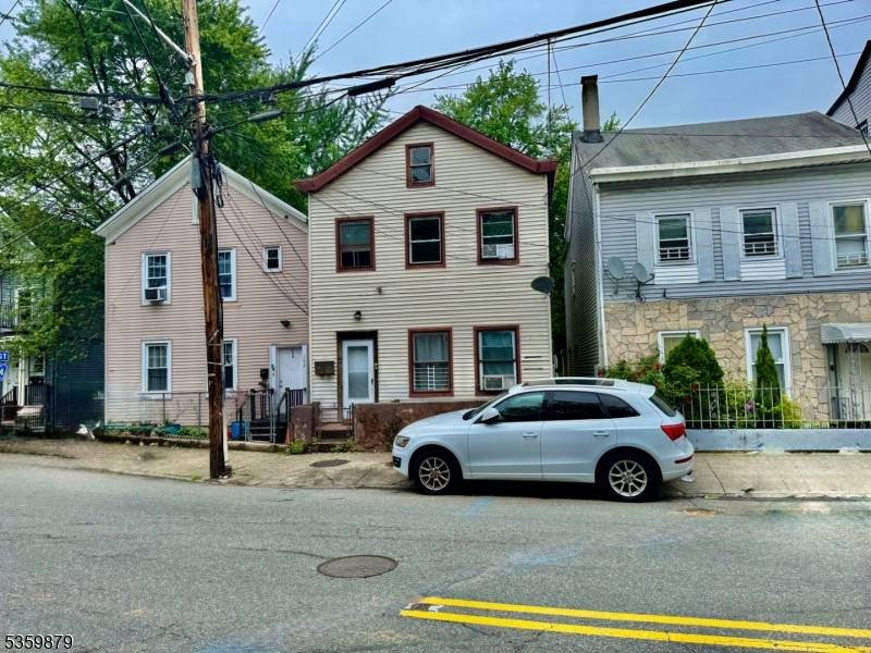 Recently Renovated Two Family Home Residentially Located Features Hardwood Floors, Central Heat much more Low Property Taxes