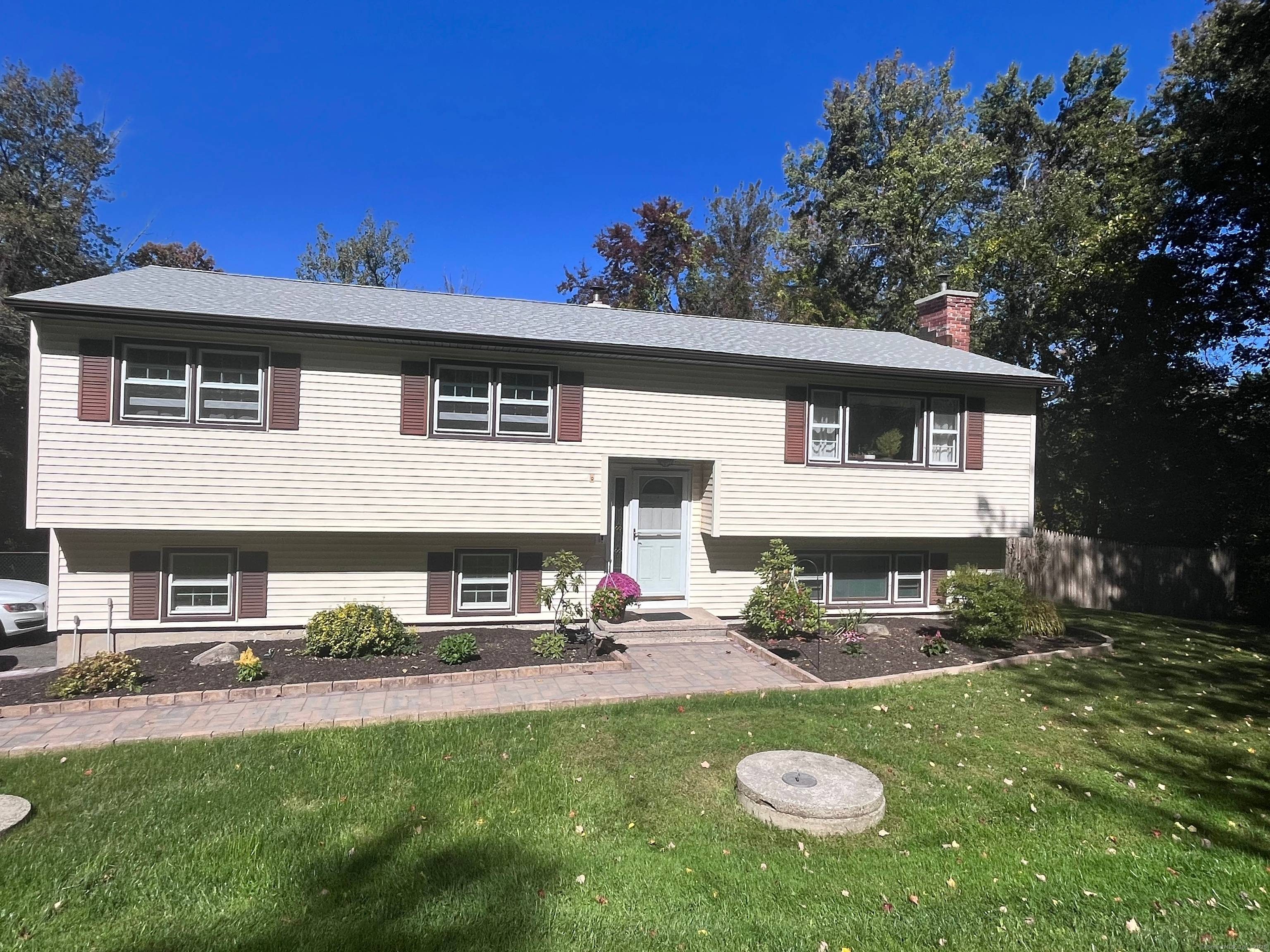 Welcome to this beautifully maintained and freshly painted raised ranch, ideally situated on a flat lot backing up to open space in one of Danbury's most desirable neighborhoods.