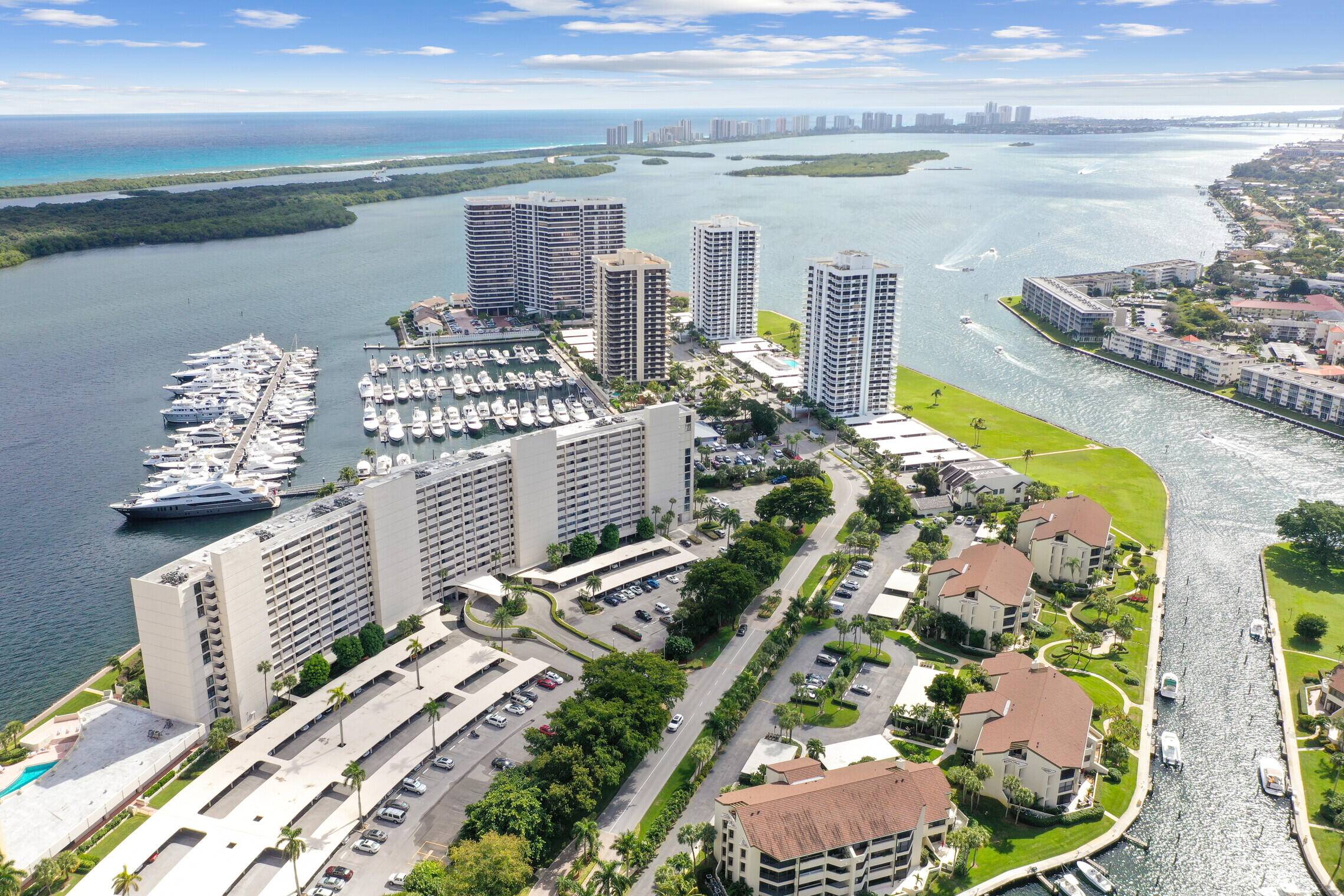Rare updated end unit with spectacular unobstructed intracoastal, city marina views in this 2 bed 2 bath with new HURRICANE WINDOWS.