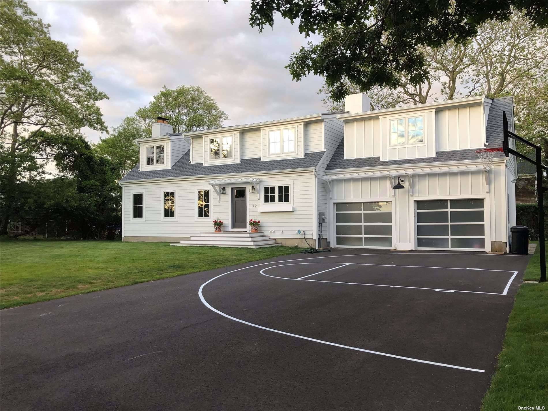 Beautifully renovated home adjacent to Meschutt Beach offers lovely light filled open floor plan with a living room with fireplace all custom styled and designed by owner.