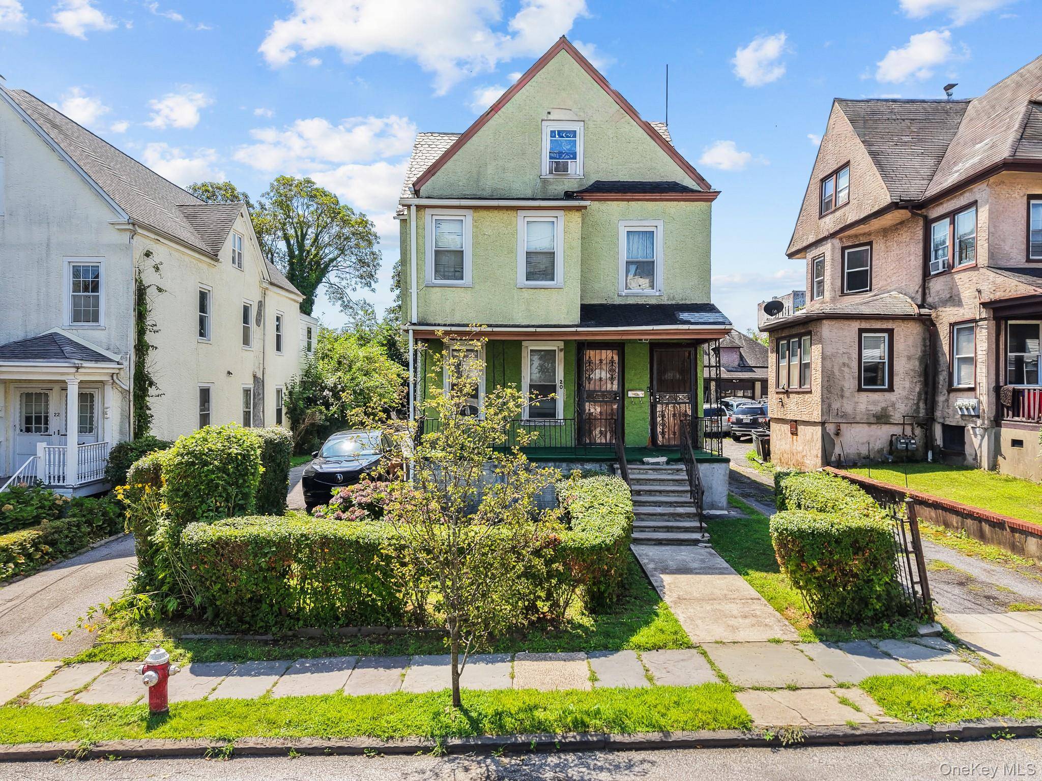 Welcome to 20 Adams Street, a detached 2 family on an oversized 30 x 142 lot on a quiet residential street with a private driveway, detached garage, and covered porch.