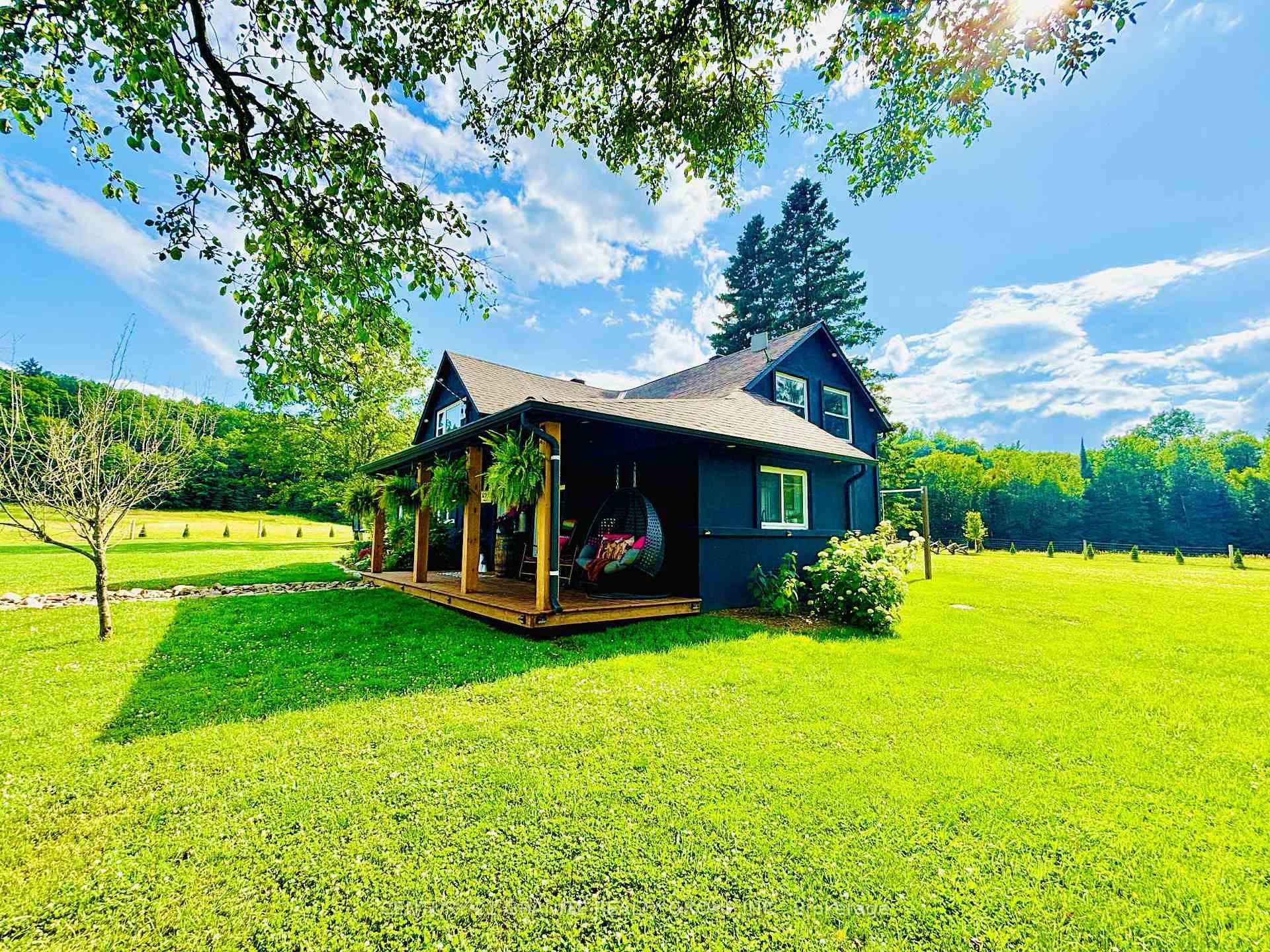 Nestled among what is locally known as the whispering pines, sits this beautifully renovated farmhouse on a 2.