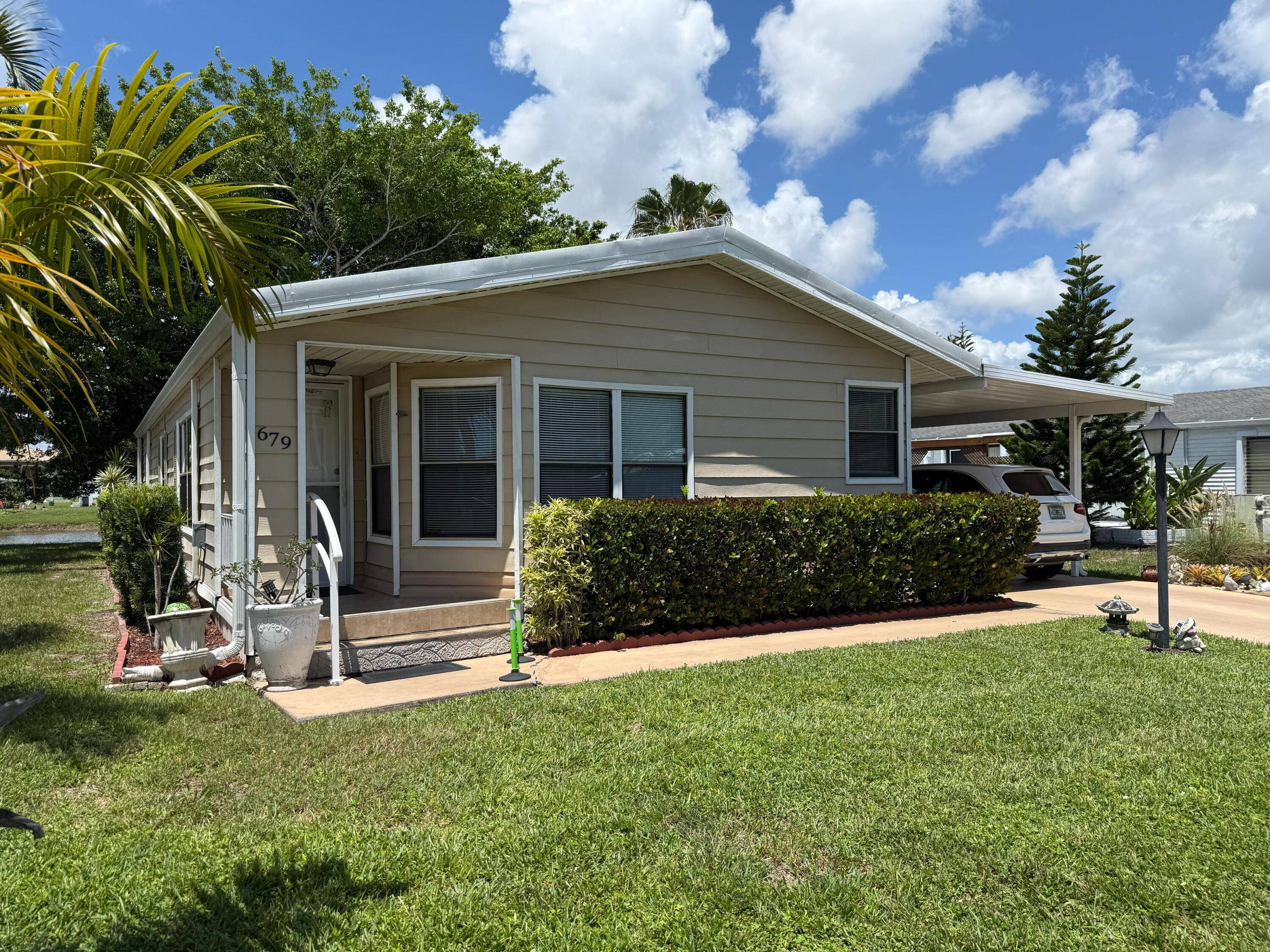 Spacious 2 2 home with stunning lake views in a vibrant 55 Boynton Beach community !
