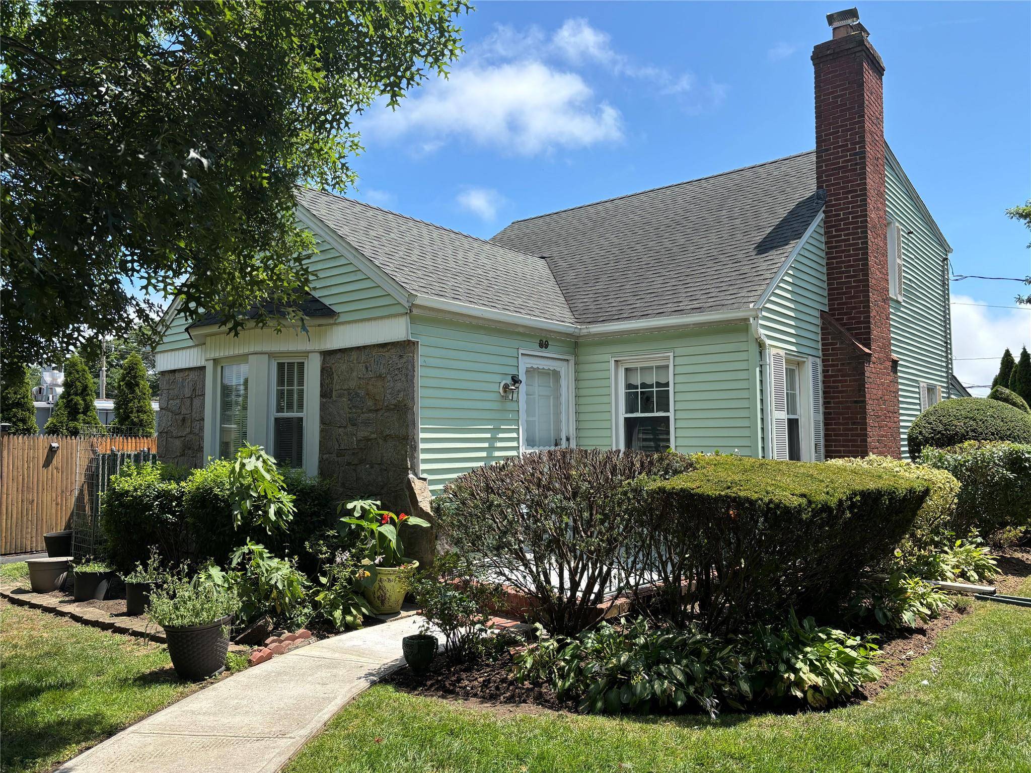This charming Expanded Cape Cod sits on a 60x100 lot.