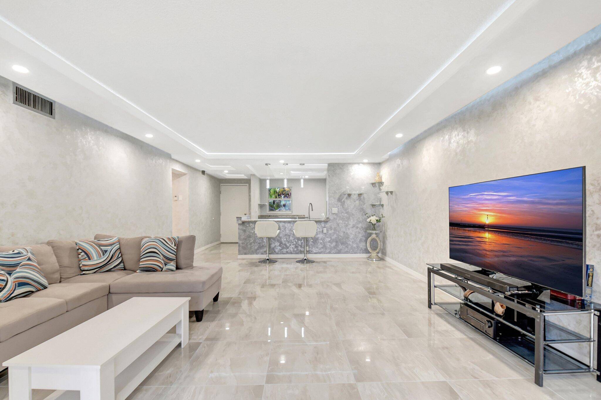 Experience luxurious living in this turnkey, bright and airy 2 2 spacious corner unit for less than you imagined in this 55 community !