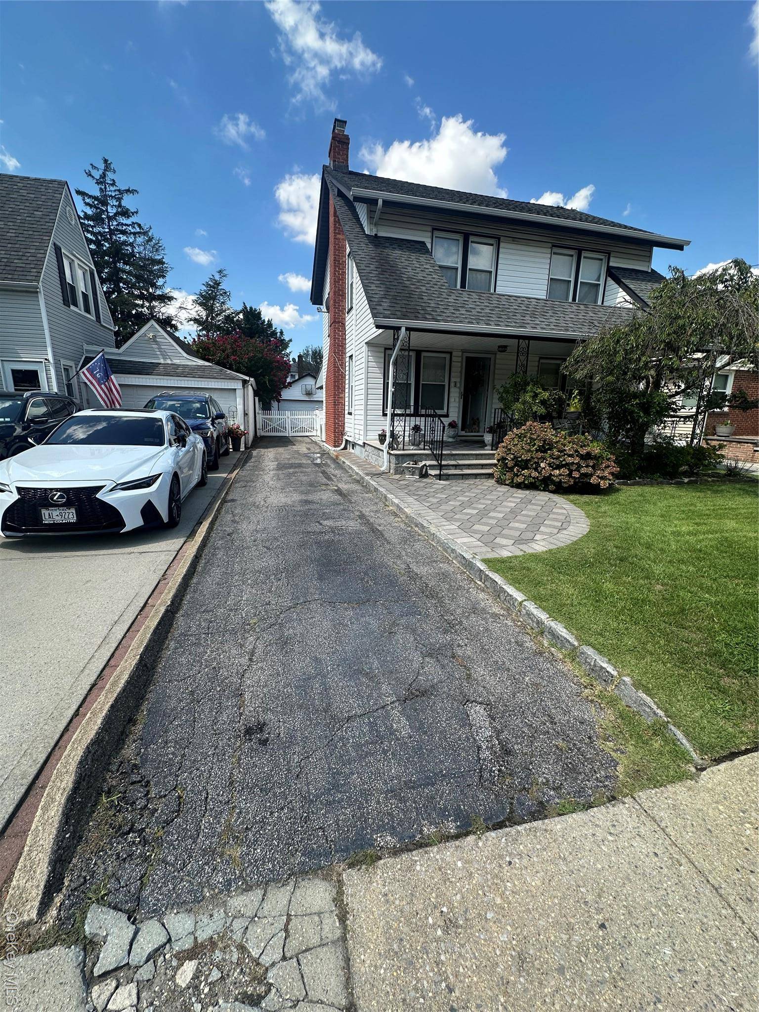 Nestled in Lynbrook, this inviting residence sits on a spacious 40x125 foot lot with a 2 car garage and a semi above ground pool.