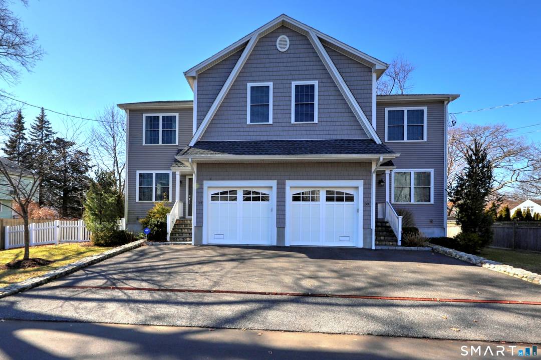 Location truly sets this home apart walk to town and the train from this upscale, newer construction townhome with elevated, modern finishes.