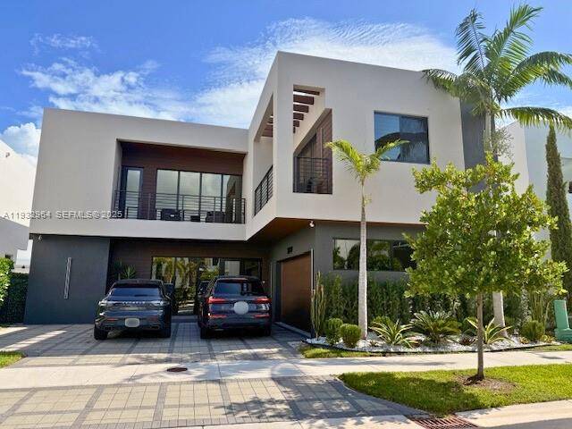 Stunning two story luxury residence located in an exclusive gated community in Doral.