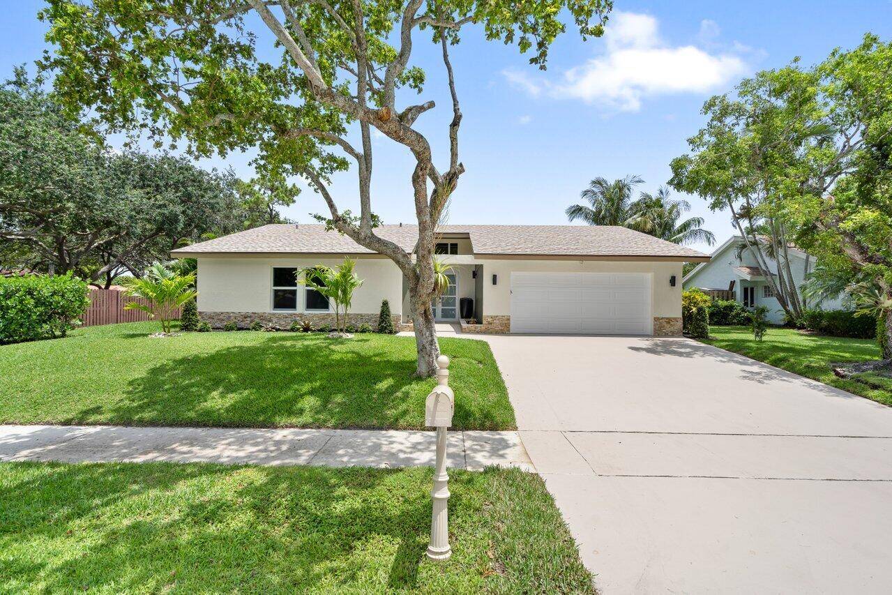 Experience Boca living at its finest in this 3 bedroom 2 bath PLUS den office area stunning corner lot home.