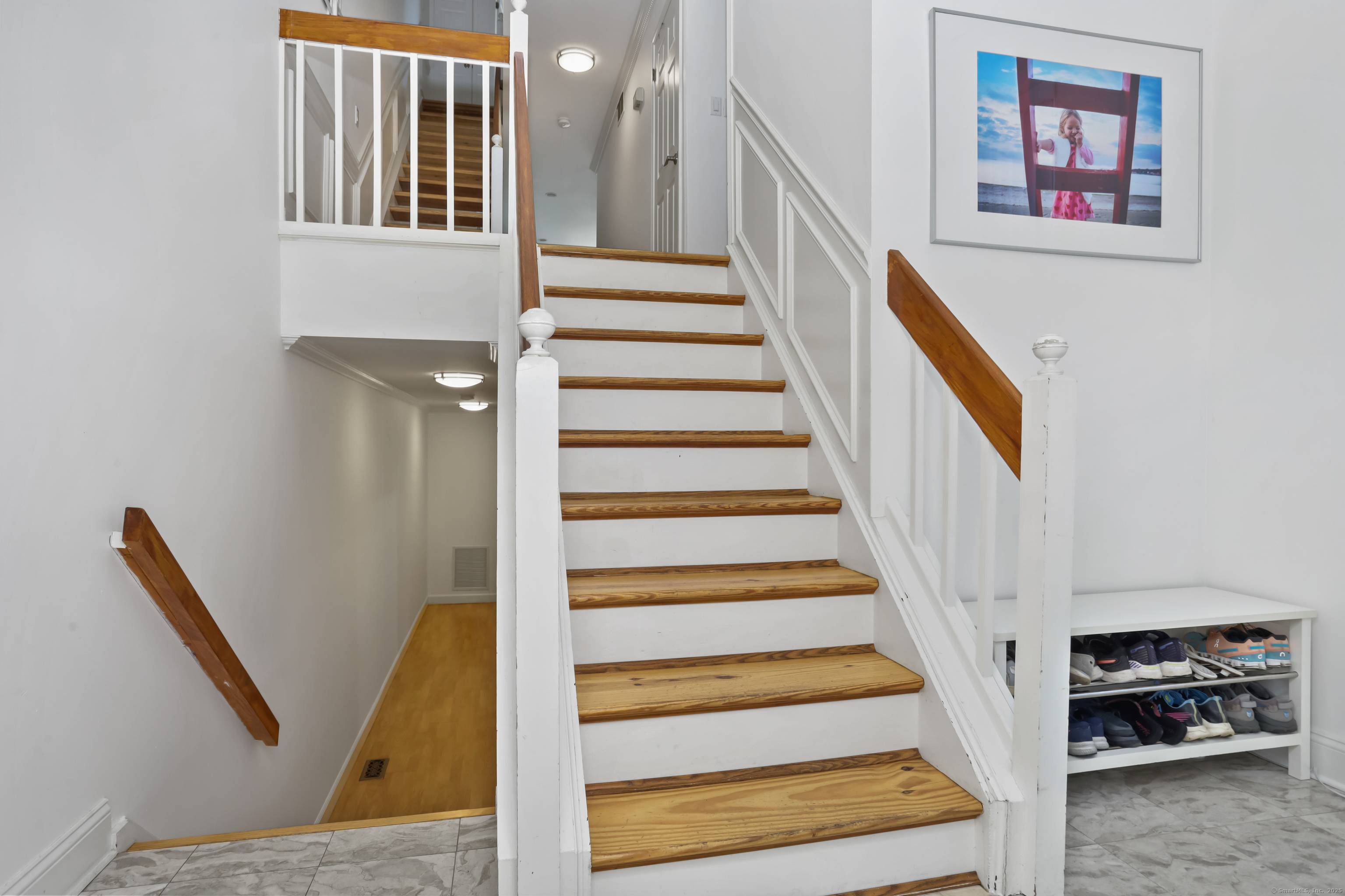 Updated 3 bedroom, 2. 5 bath Shippan Point townhouse with open main level, fireplace, and sliders to a deck overlooking park like grounds.