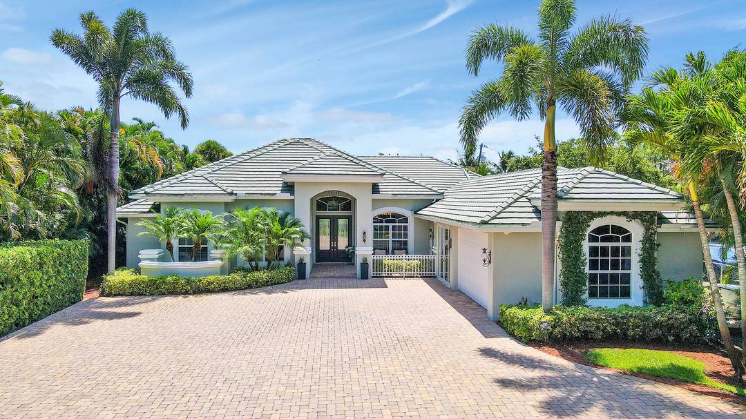 Welcome to 19560 Gulfstream Drive, a distinguished waterfront estate in Jupiter, FL, where luxury seamlessly blends with tranquility.