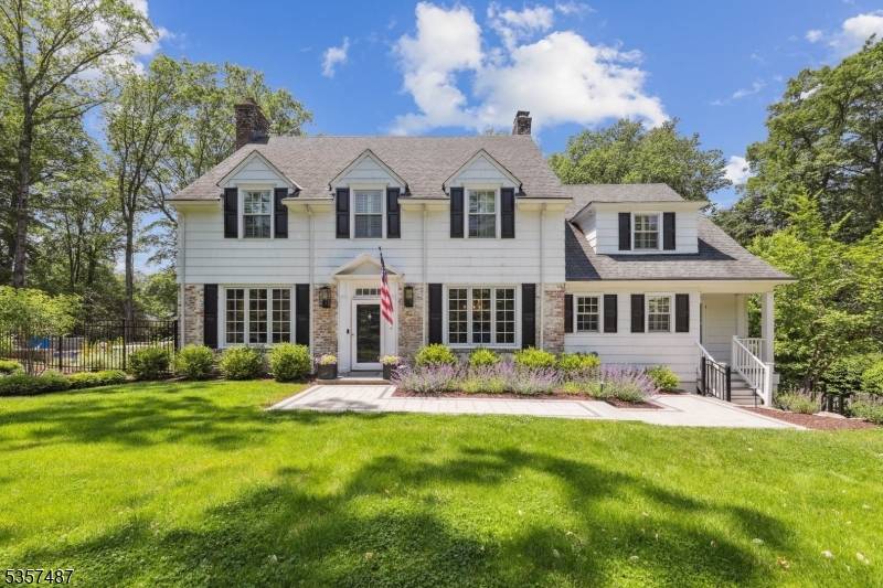 Nestled on one of Summit's most desirable Northside streets, this timeless Colonial residence masterfully blends classic elegance with modern luxury.