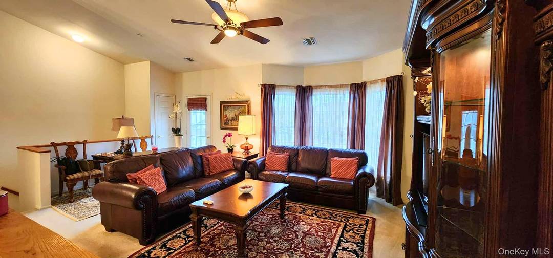 Large Second Level Unit in a 55 Plus Community with Open Floor Plan with Cathedral Ceilings.