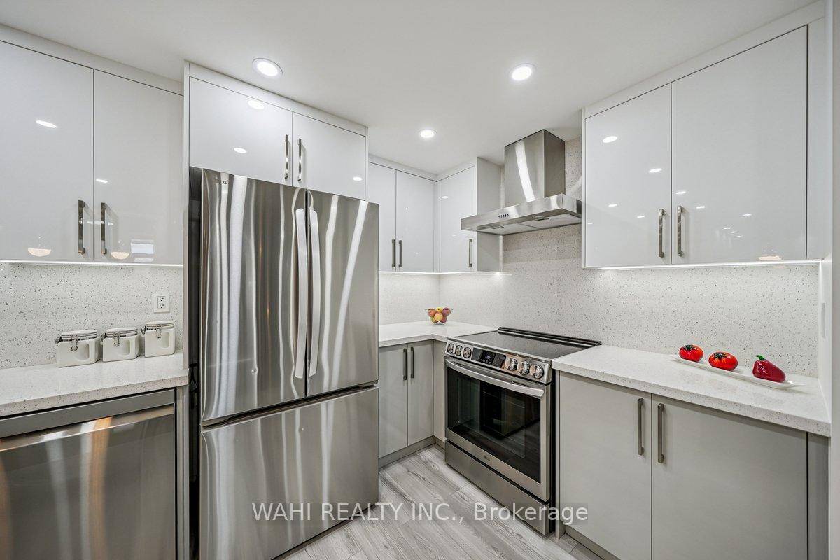 Stunning, fully renovated 3 bed, 2 bath condo in sought after Markland Wood !
