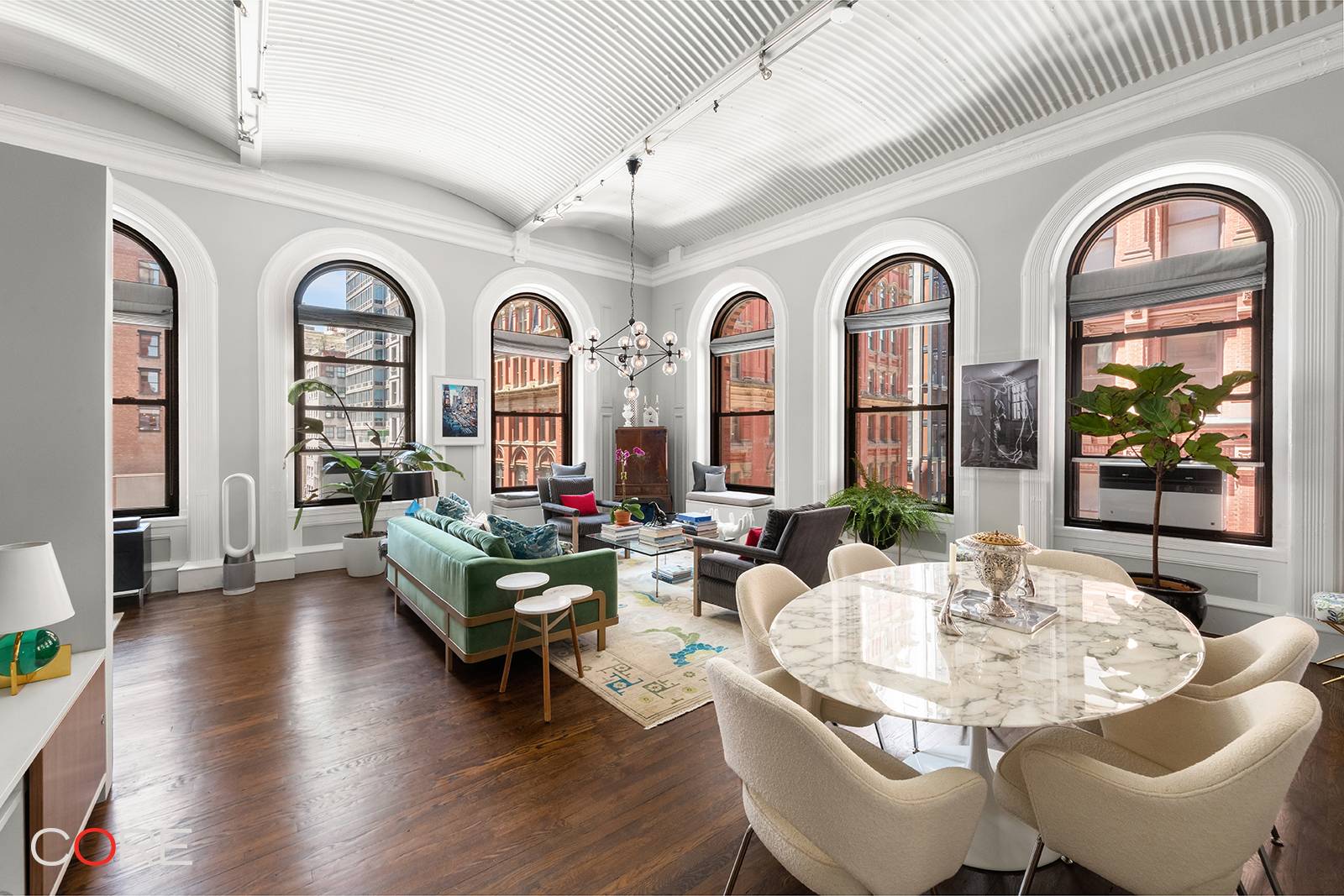 Welcome home to this stunning, sun drenched loft wrapped in nine oversized windows, offering picturesque city views to the south and west.