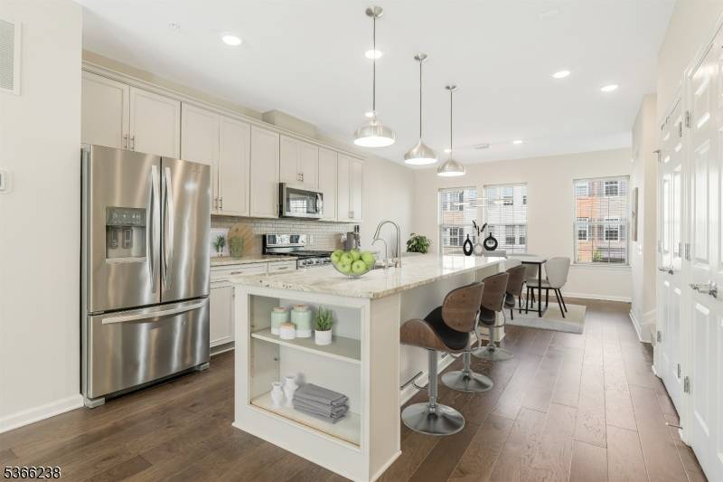 Stunning 3 level townhome, 2000 sq ft of modern living in the sought after Livingston Square community.