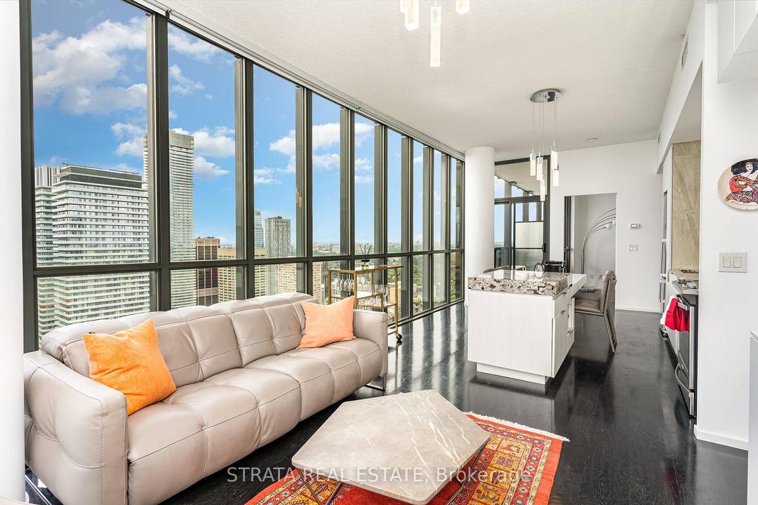 Spectacular Fully Furnished 2 bedroom, 2 bath corner residence perched on the 47th floor, showcasing sweeping south and west exposures.