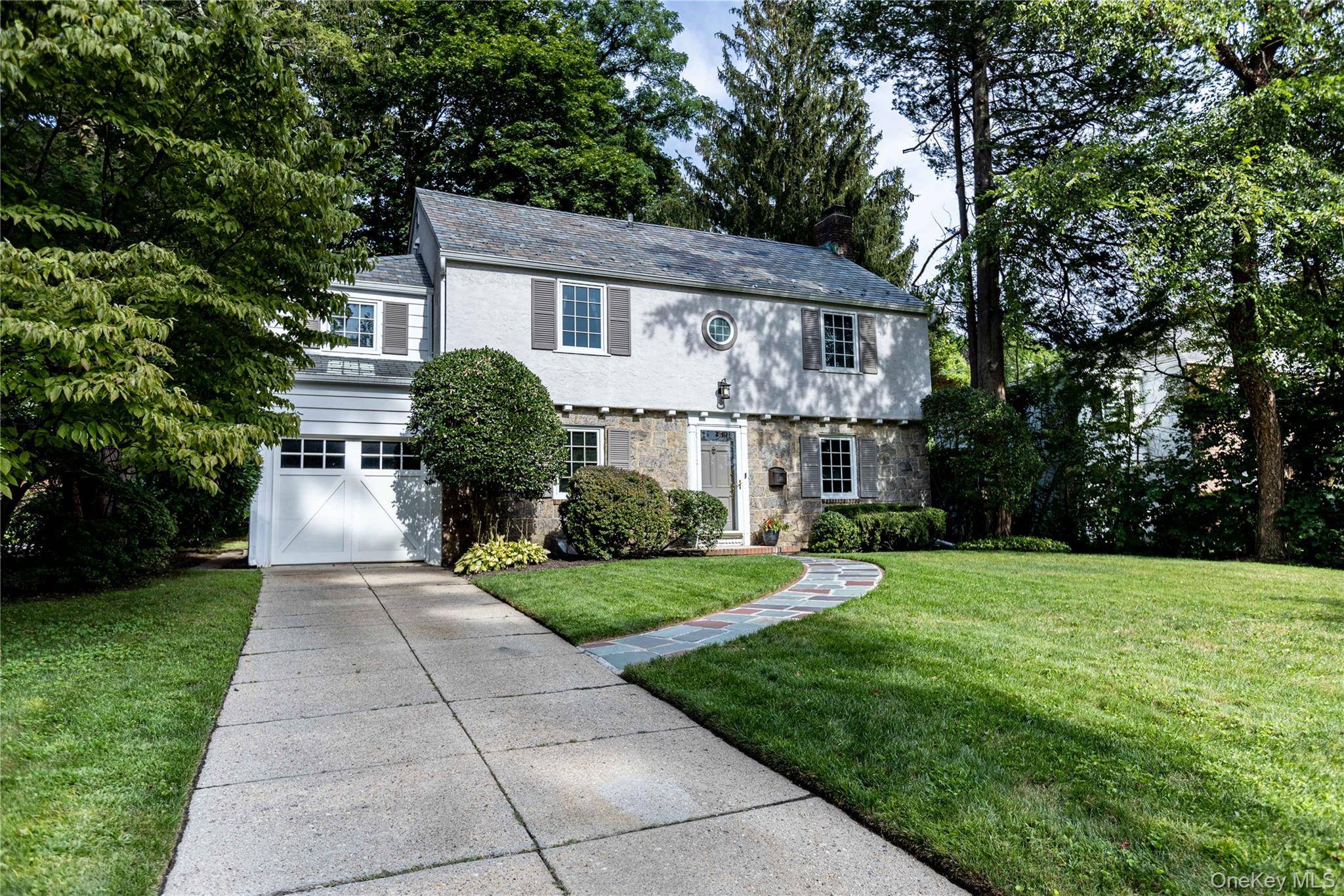 Welcome to Manhasset ! 20 Mill Spring Road offers classic colonial architecture with a modern twist.