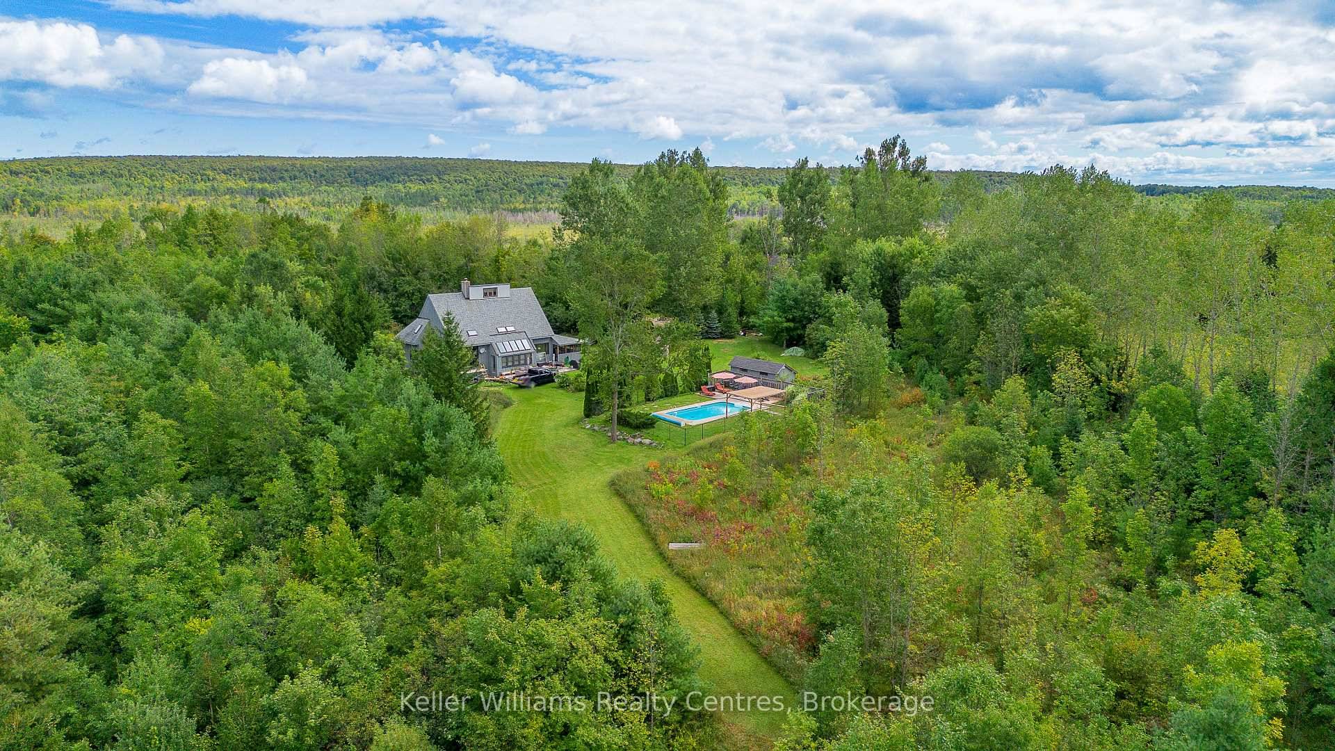 Tucked into 25 acres of forested privacy and stretching across 900 feet of shoreline on wild and raw Gowan Lake, this is a retreat you'll never want to leave.
