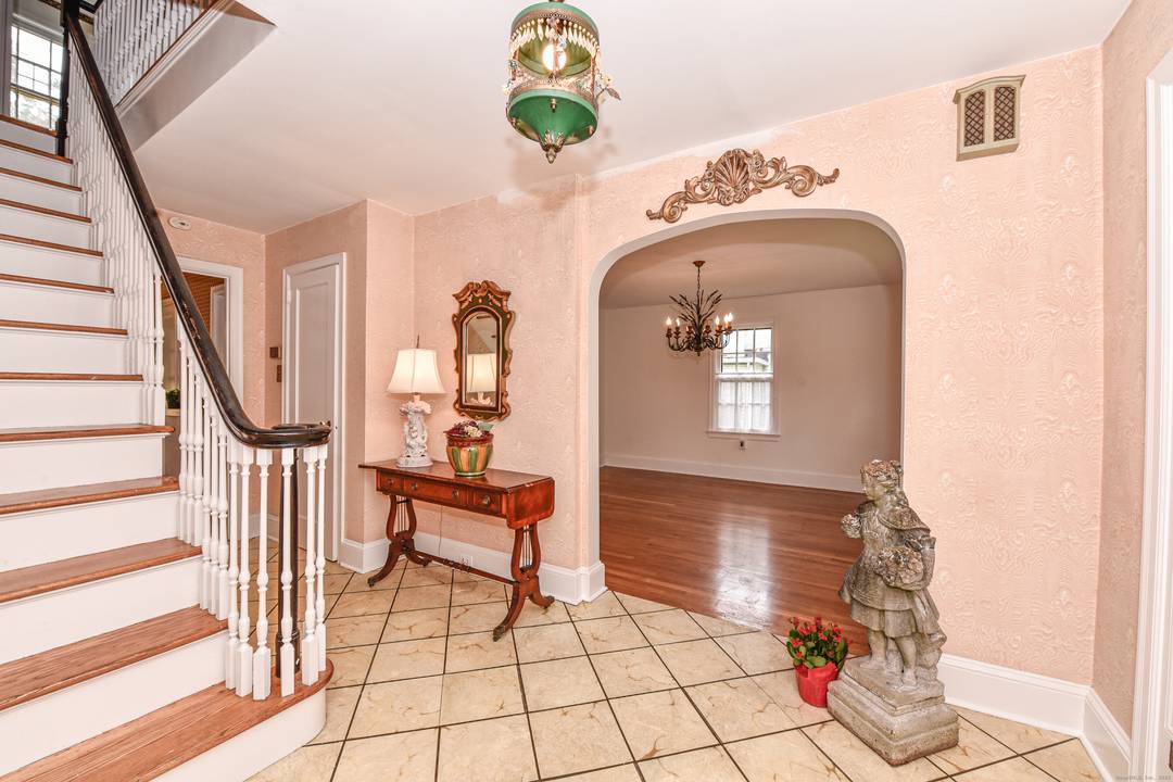 Step into timeless elegance with this beautifully maintained center hall Colonial located in the beautiful Brooklawn neighborhood of Fairfield.