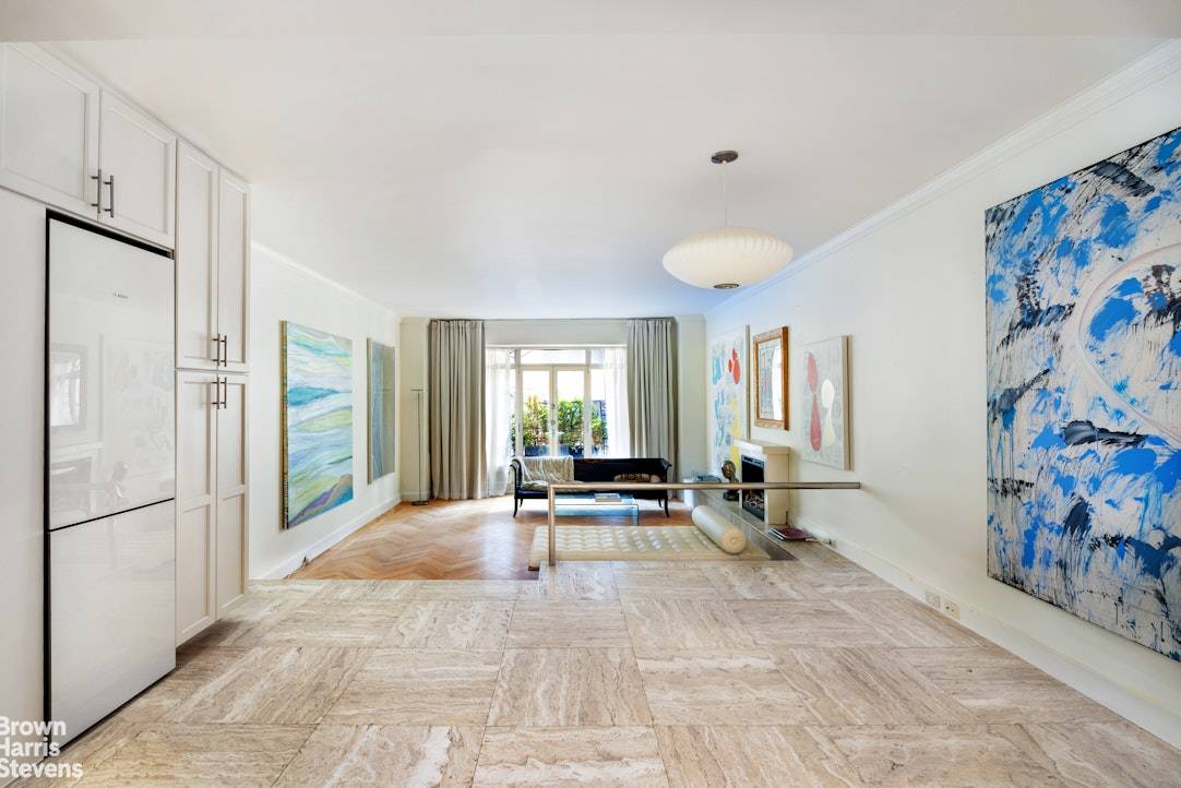 Enjoy loft like living in this unique Central Park South one bedroom residence with new kitchen, elegant entry foyer and a home office.