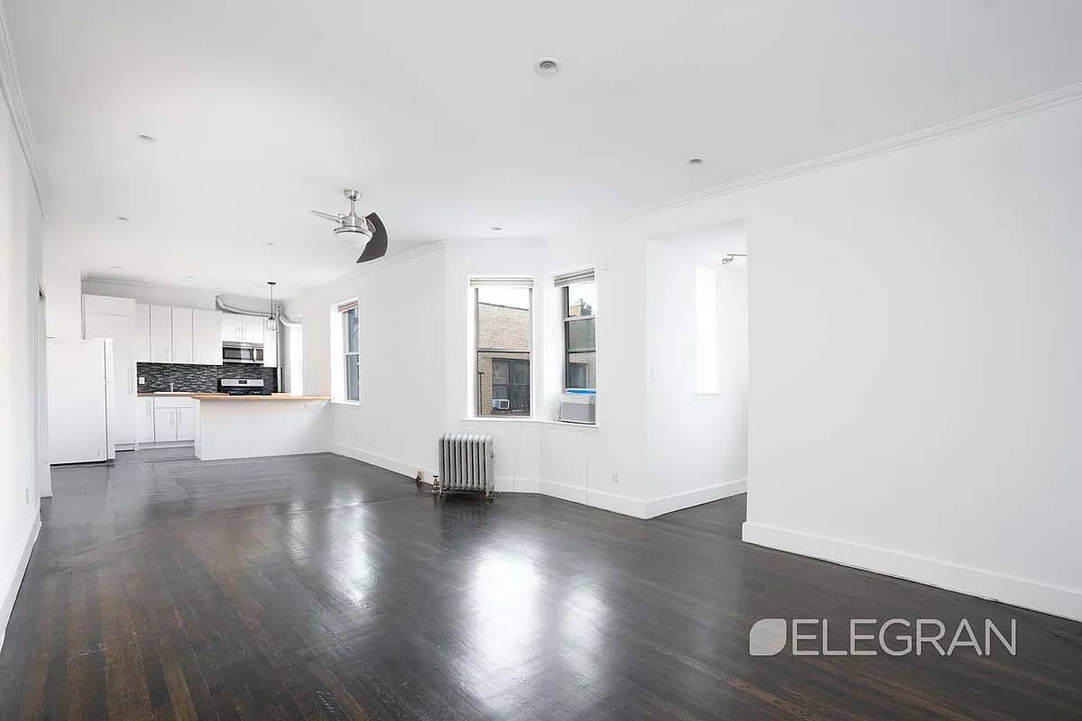 Perched atop a pre war elevator building on a tree lined block in Clinton Hill, this oversized 800 square foot apartment pairs classic charm with modern upgrades.