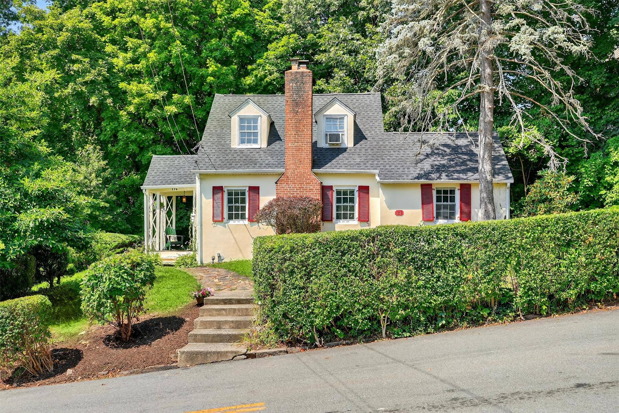Welcome to this charming Cape Cod gem, perfectly situated in a serene neighborhood that seamlessly blends tranquility with convenience.